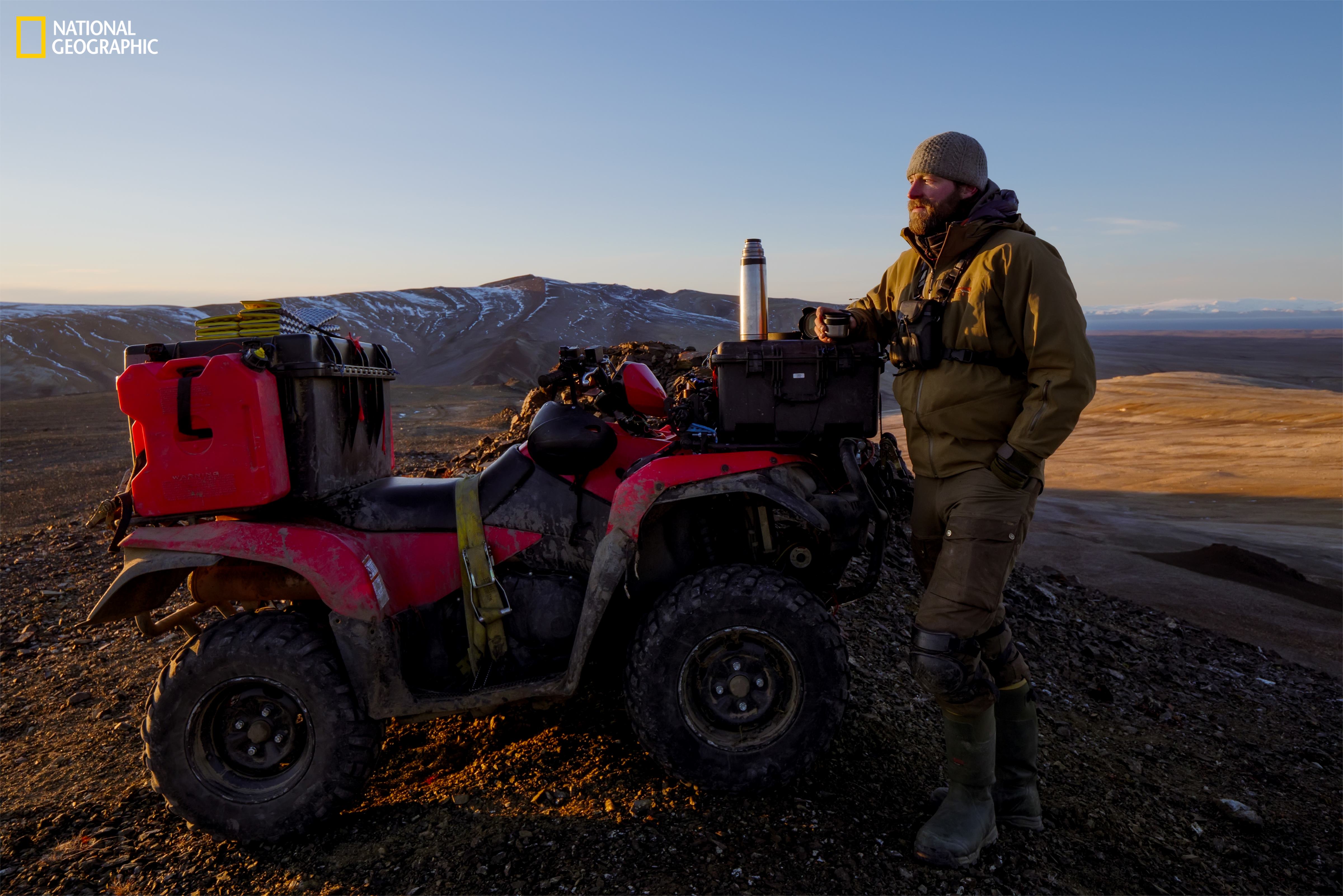 Ronan Donovan stands with an all-terrain vehicle