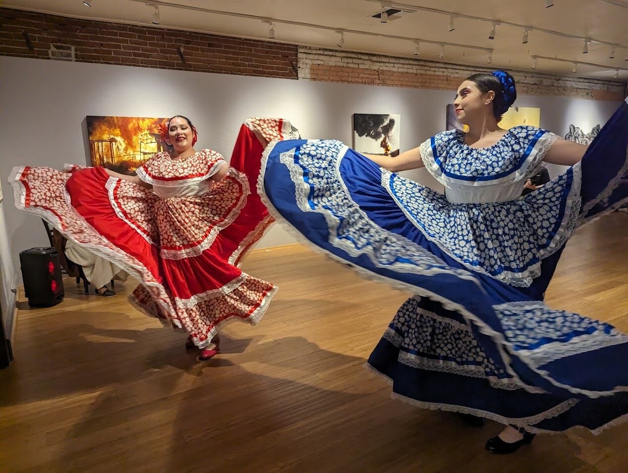 Two ballet folklorico dancers spinning