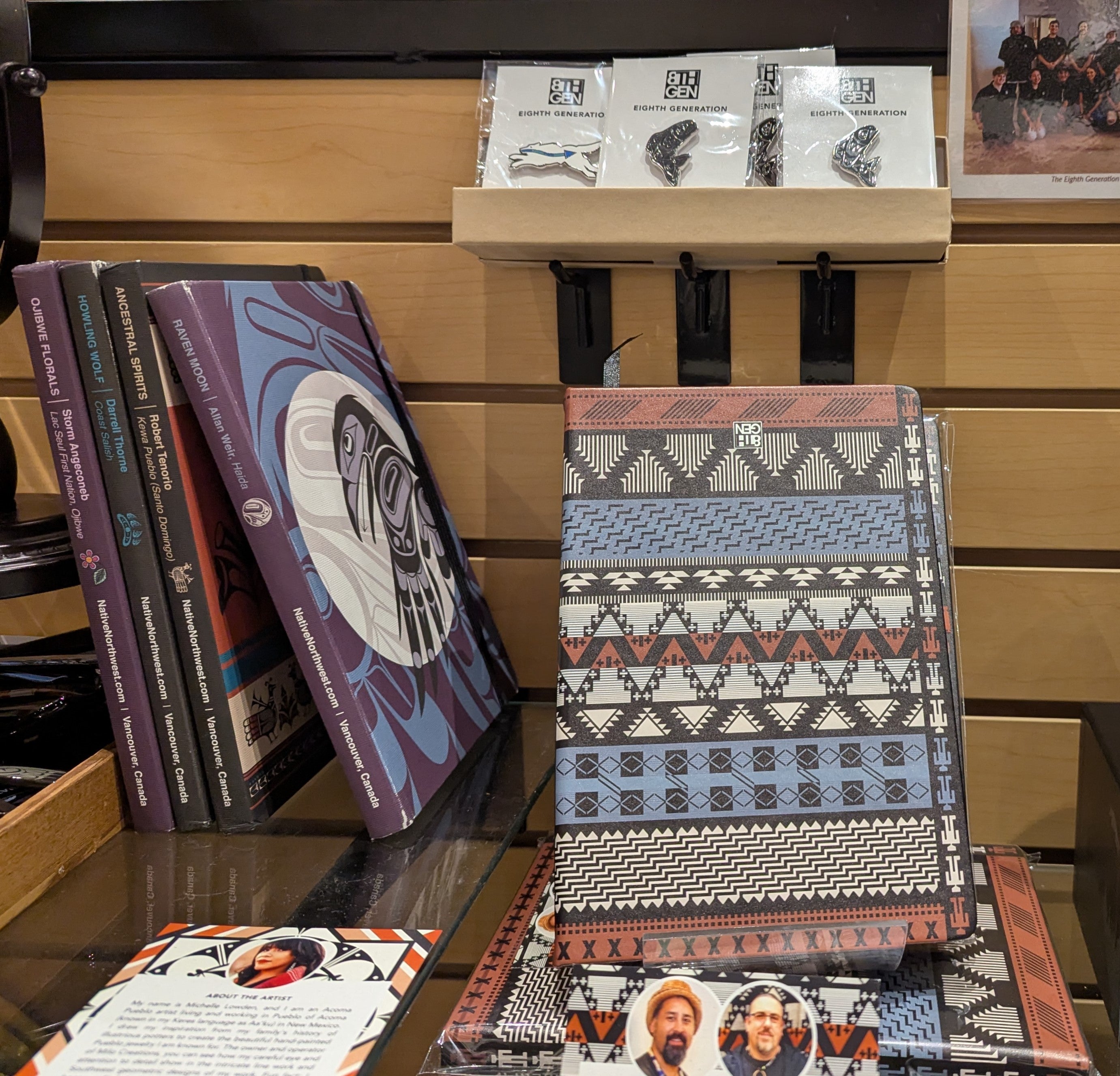 A stack of journals with patterns designed by Indigenous artists in North America