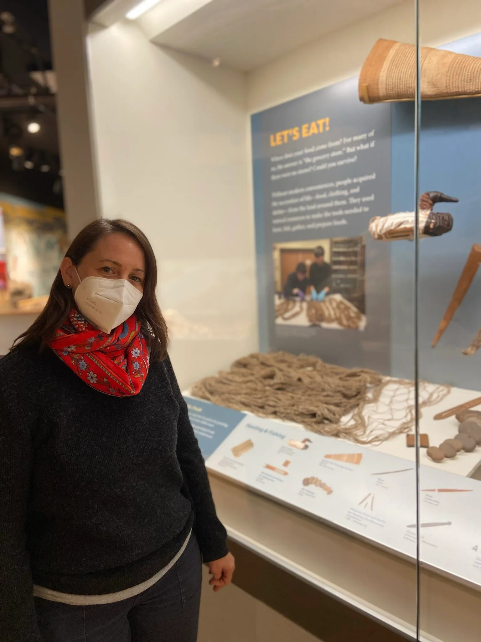 Elizabeth Kallenbach in front of basketry