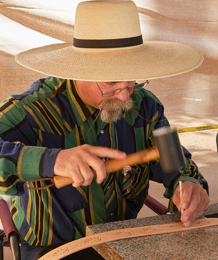 Buckaroo and traditional saddle maker, Steve McKay, demonstrates tooling leather.