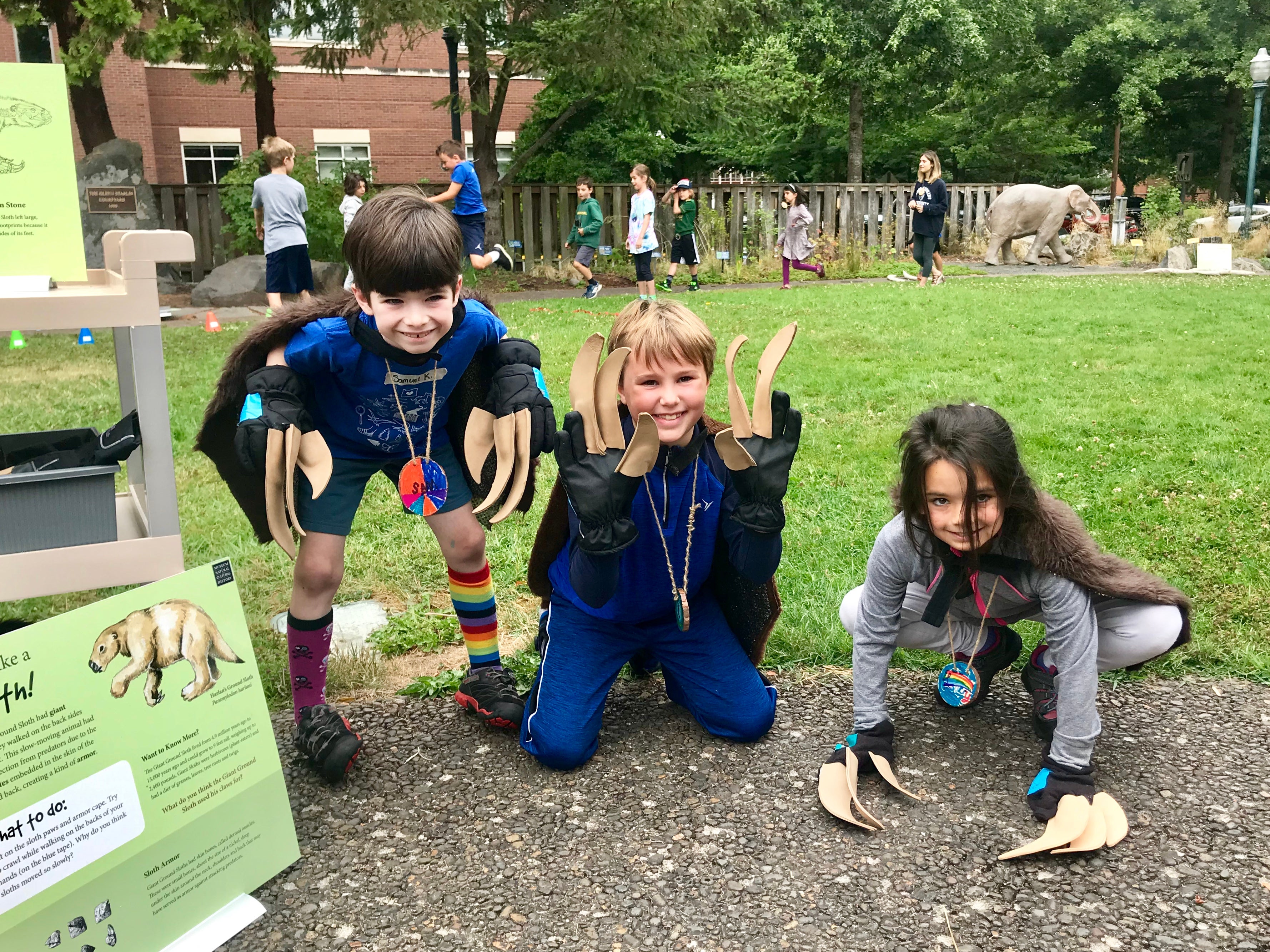 Three young kids with claws like giant sloths