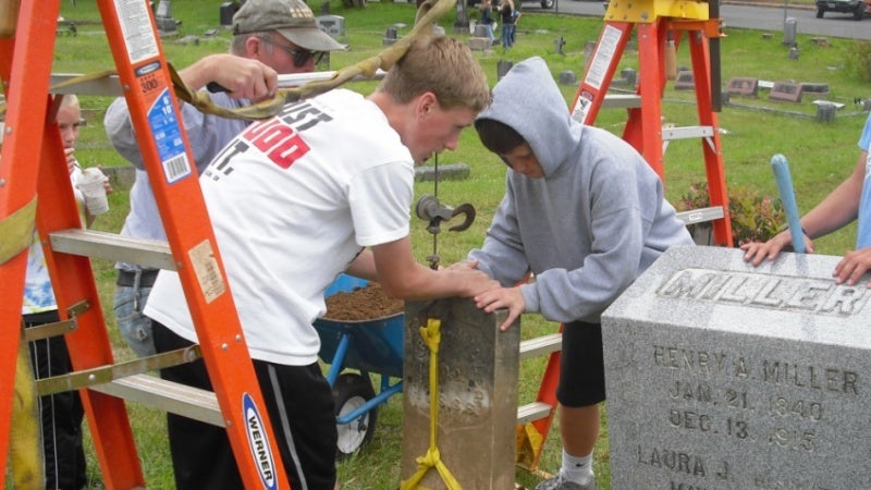 Marshfield HS students tending the pioneer cemetery 