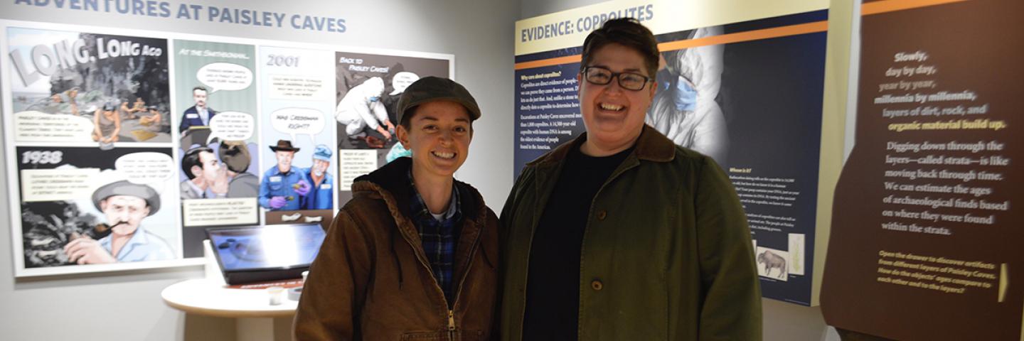 A smiling couple enjoying the exhibits during an evening at the museum