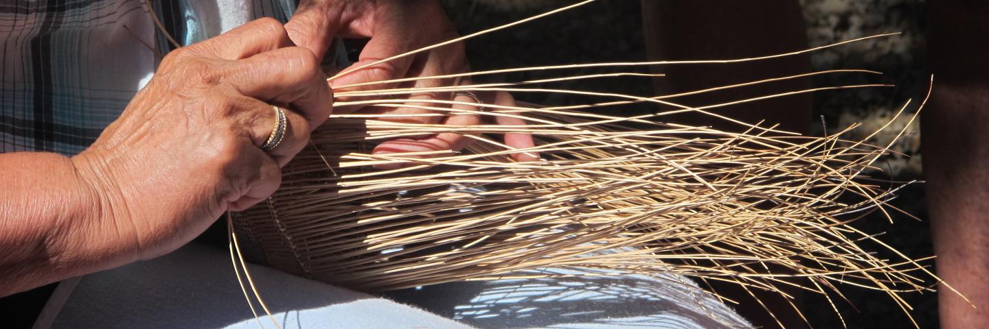 Wilverna Reece weaving a basket.