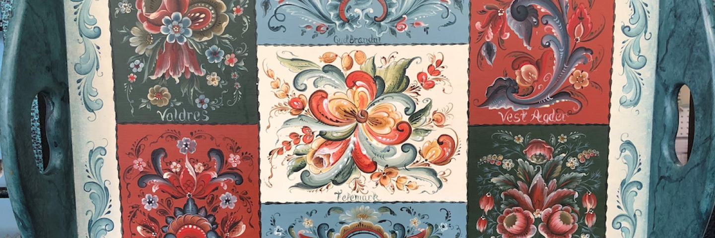 A tray with various Rosemåling styles.