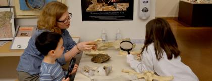 Family looking at bones in the museum