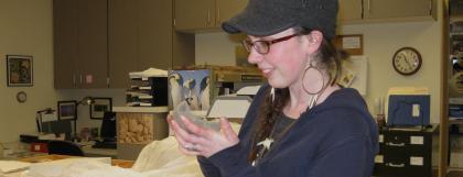 Student looking at an artifact