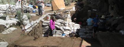 People working at an archaeology site in the bright sun