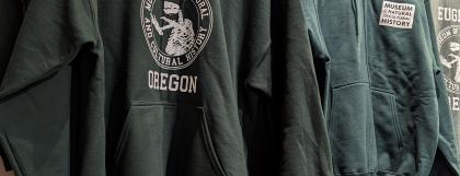 Hanging display of museum-branded hoodies
