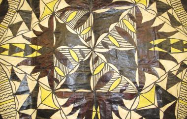 Tapa cloth detail of yellow pigments and symmetrical leaf design