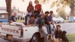 Lesbians posing with dogs on a truck
