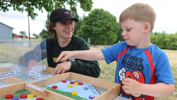 Outreach educator Bear Elliott (left) engaging kids in science
